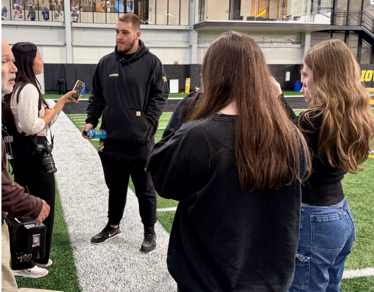 Gianna Liu '25 speaks with University of Iowa offensive lineman Beau Stephens 